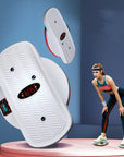 White home twisting machine for exercise with textured footplates shown with woman working out